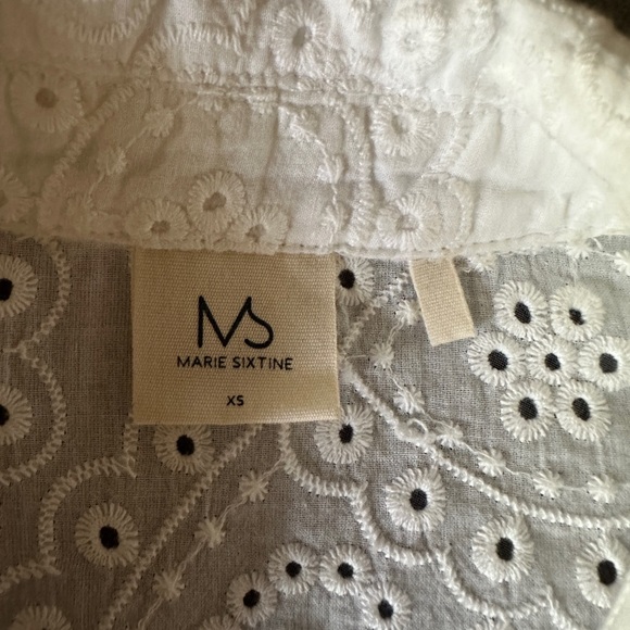 White eyelet shirt. Front of shirt has a lining. Was purchased in Paris. - Picture 3 of 3